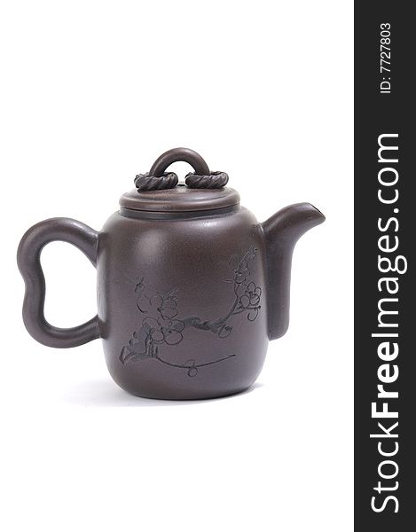 Isolated clay teapot on white background