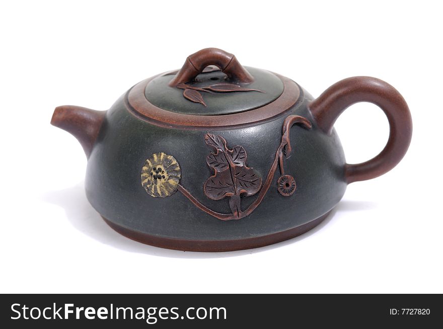 Isolated clay teapot on white background