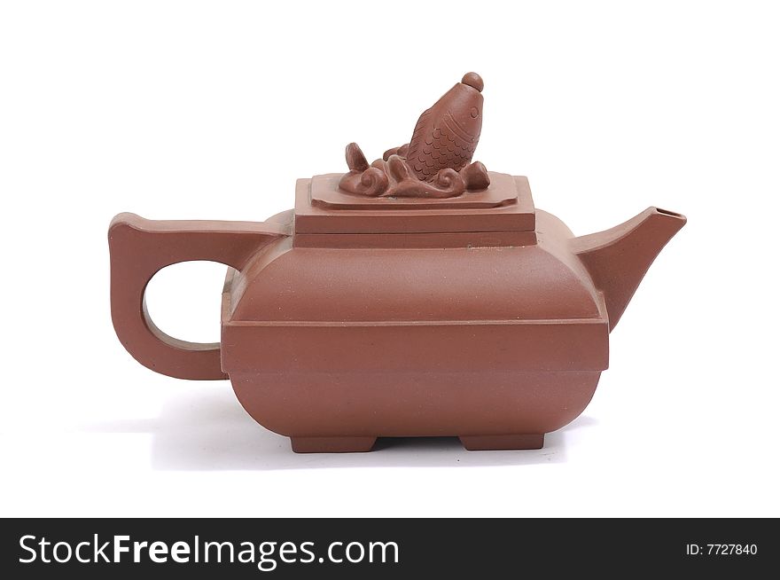 Isolated clay teapot on white background