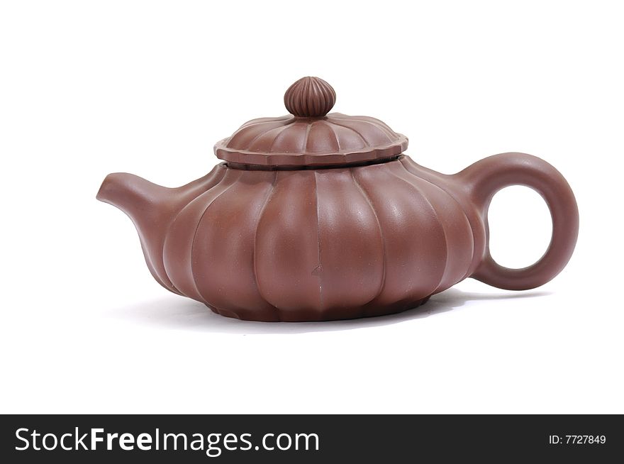 Isolated clay teapot on white background