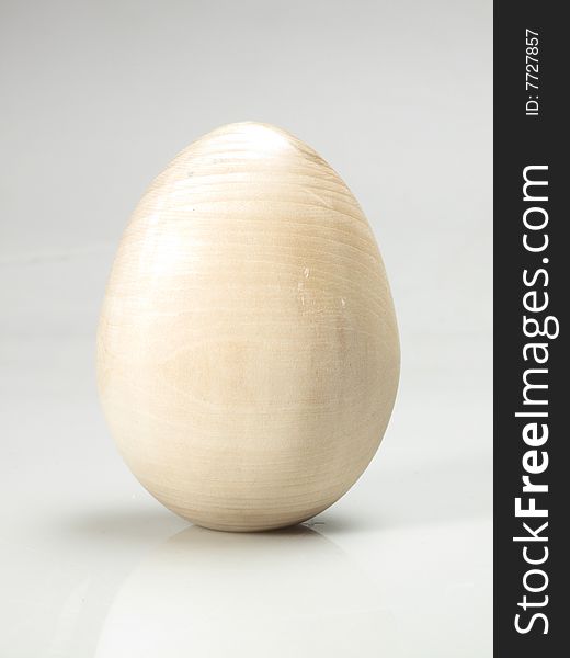 Wooden egg for decorative painting on white ground