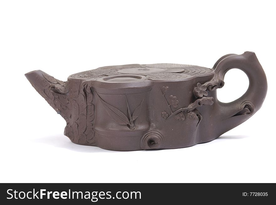 Isolated clay teapot on white background