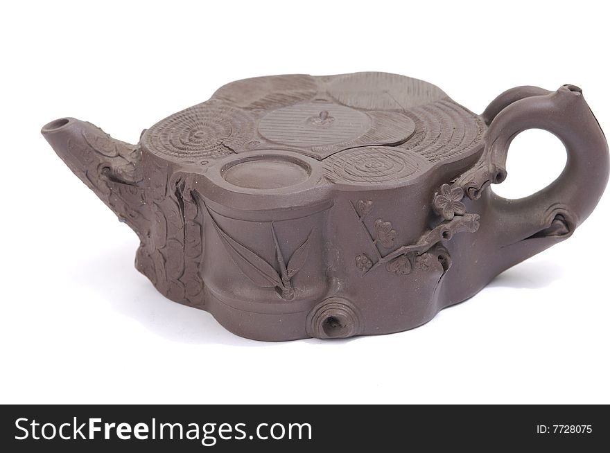 Isolated clay teapot on white background