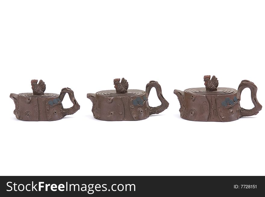 Isolated clay teapot on white background