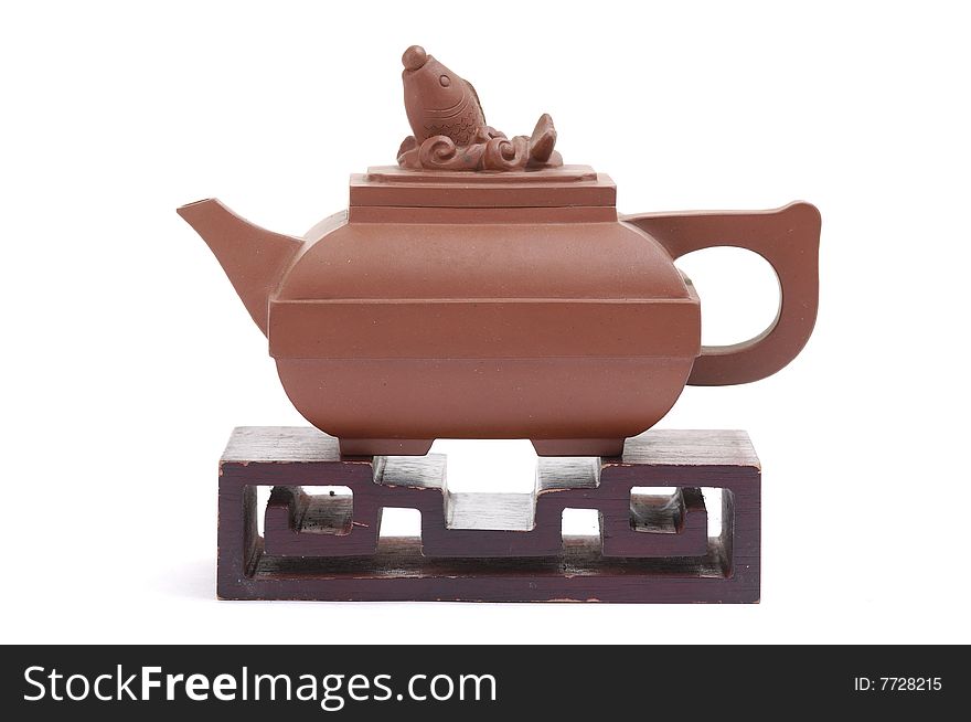 Isolated clay teapot on white background