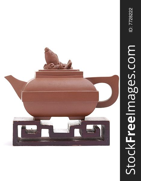 Isolated clay teapot on white background