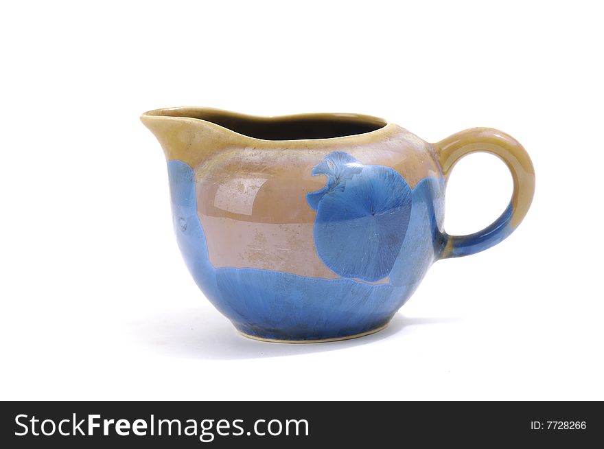 Isolated clay teapot on white background