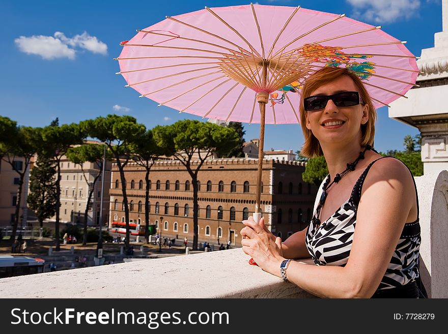 Lovely Woman With Pink Sunshade In Rome