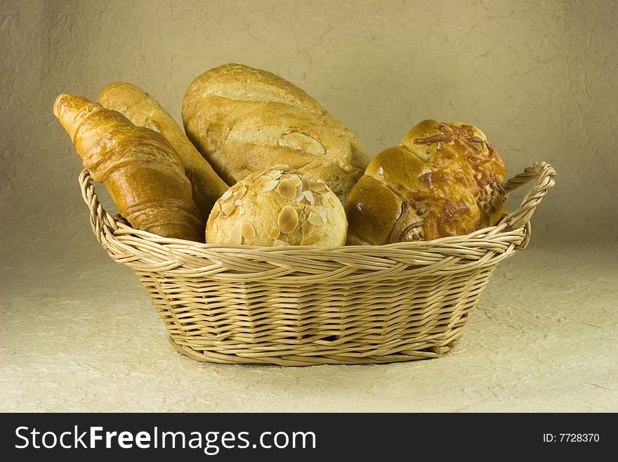 Bread, croissant, baguette on basket