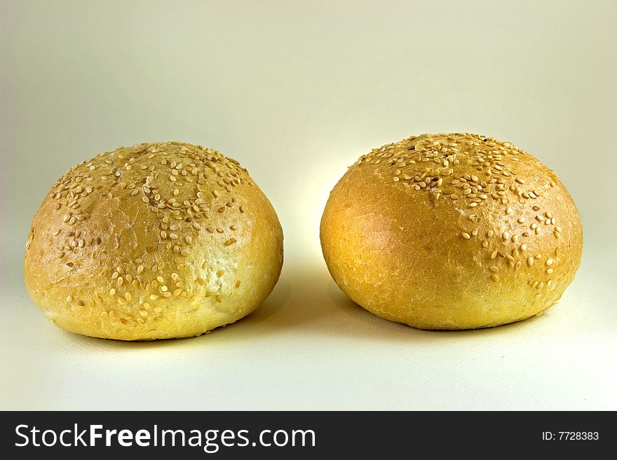 Two sesame buns on white background