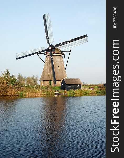 Windmill with little house in Kinderdijk near Rotterdam (Holland)