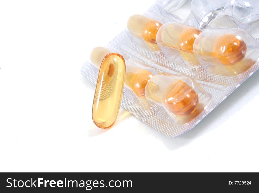 Some pills, capsules in package isolated on white. Bright, and clear.