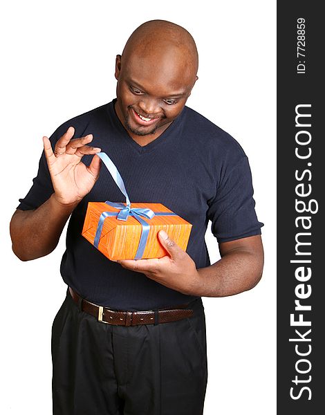 A young man holding a present. Isolated on white.