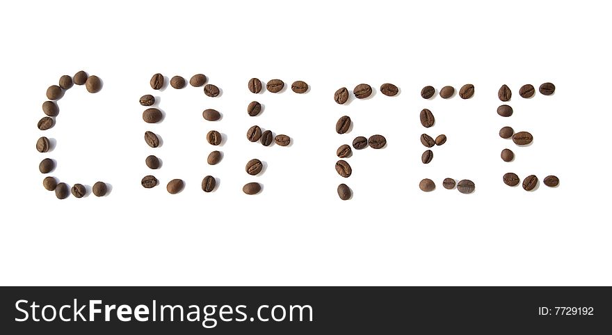 Word Coffee from coffee grains on a white background.