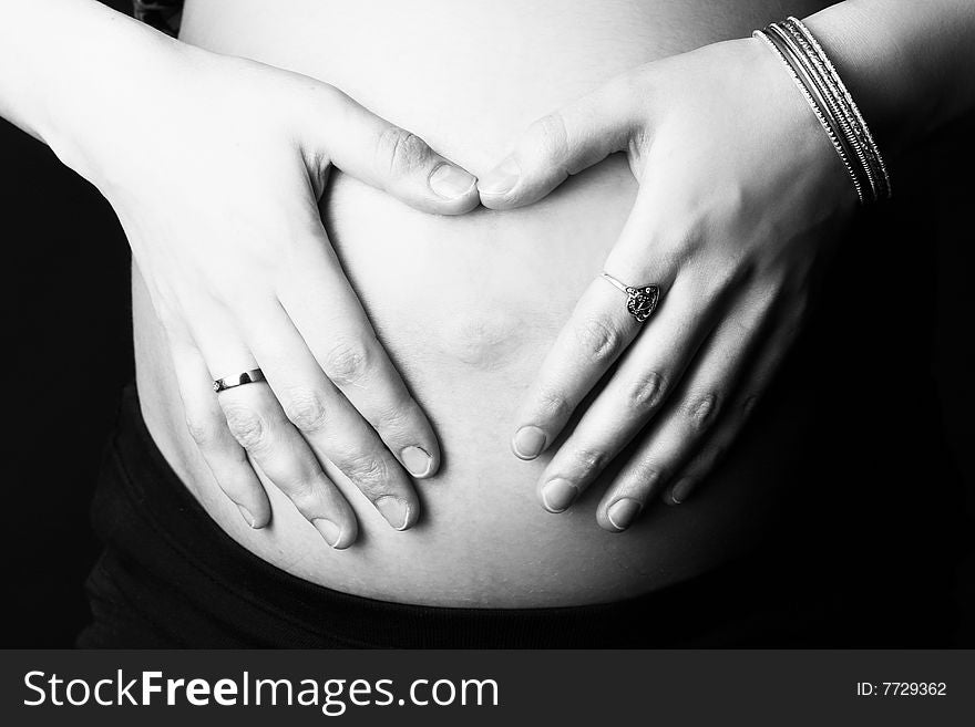 Hands of the pregnant woman on a stomach. Hands of the pregnant woman on a stomach