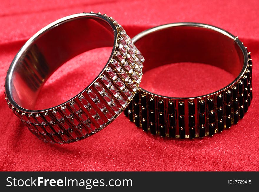 Fashion bracelets on red background