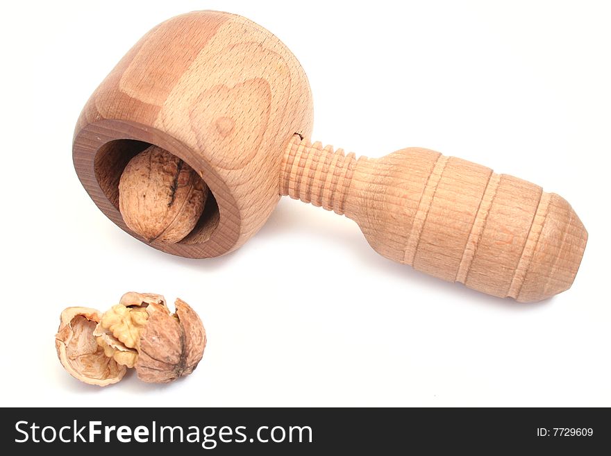 Nutcracker and walnut isolated on white background
