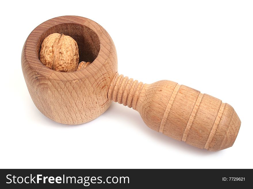 Nutcracker and walnut isolated on white background