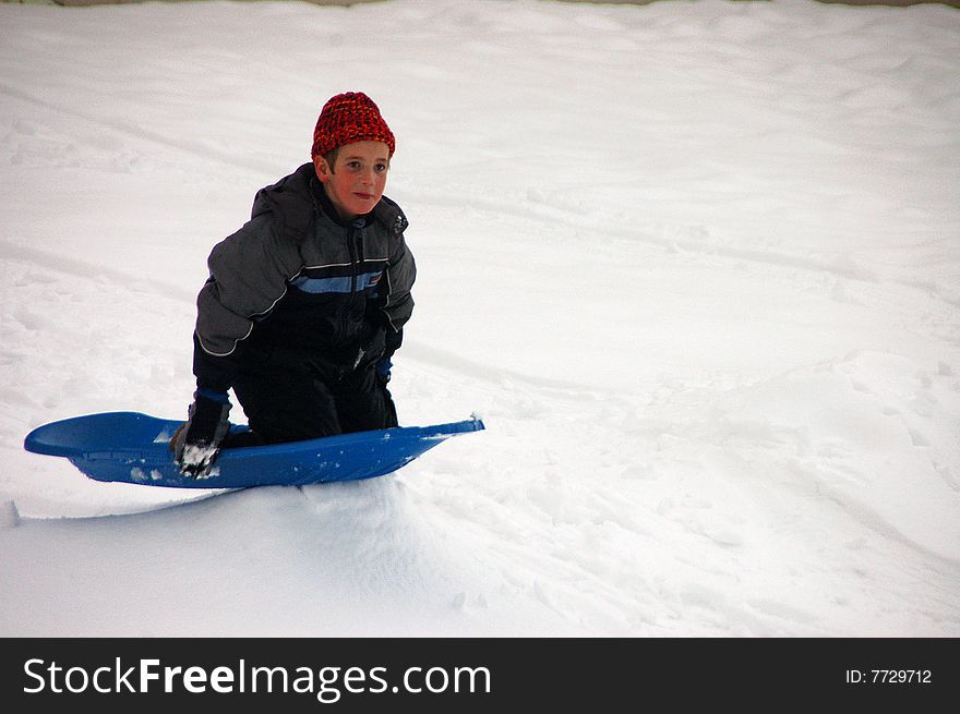Boy sledding on Christmas Day