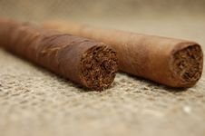 Two Cuban Cigars On Hessian Canvas Royalty Free Stock Photography