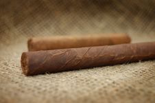 Two Cuban Cigars On Hessian Canvas Stock Photos Two Cuban Cigars On Hessian Canvas Stock Photos