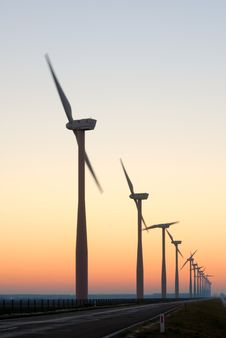 Windmill Silhouettes At Dawn Stock Images
