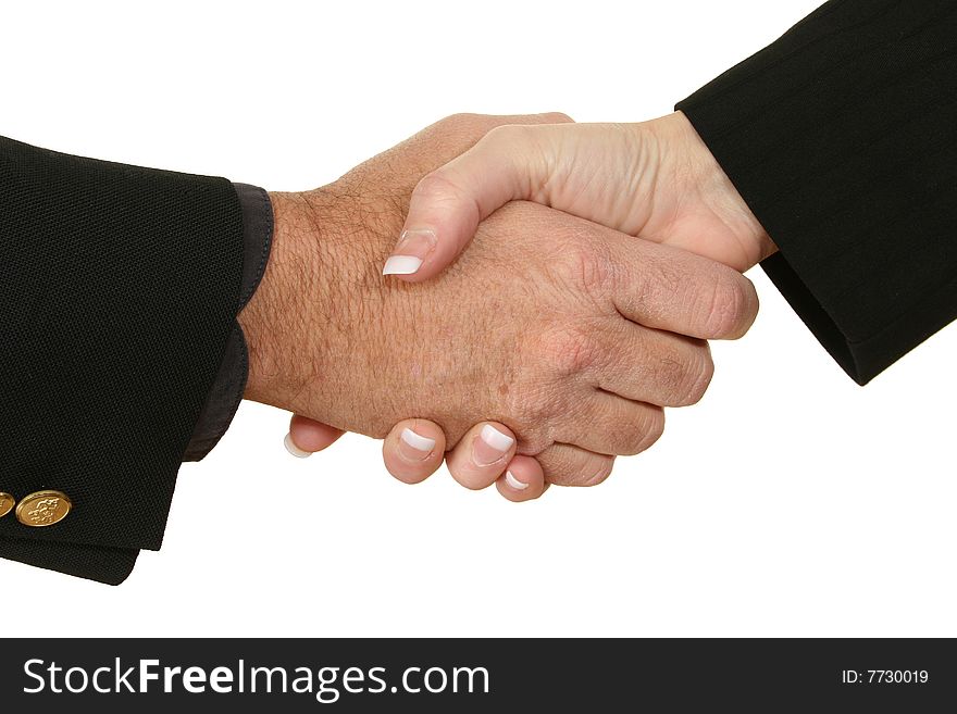 Male and female hands in suits shaking hands. Male and female hands in suits shaking hands.