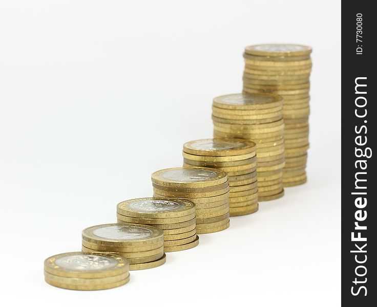 Columns of coins against white background