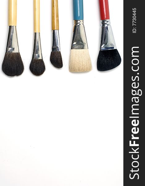 Cosmetic brushes on white background