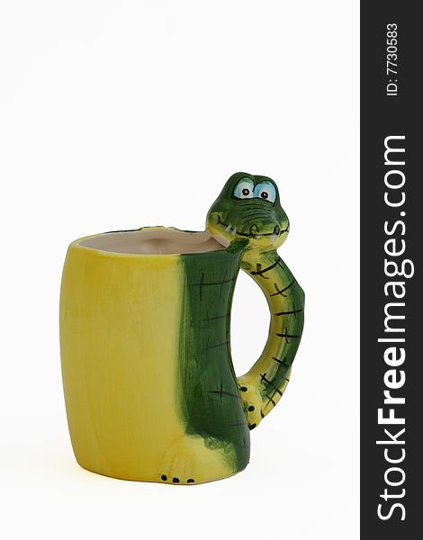 It ' a funny cup for children whose handle looks like crocodile. It ' a funny cup for children whose handle looks like crocodile