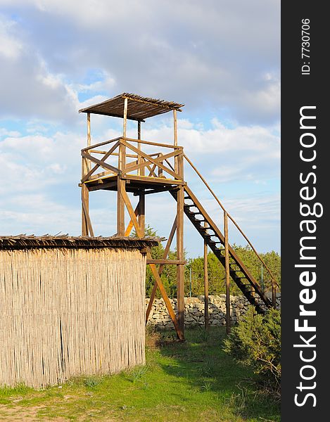 Watchtower in a natural park on cloudy sky