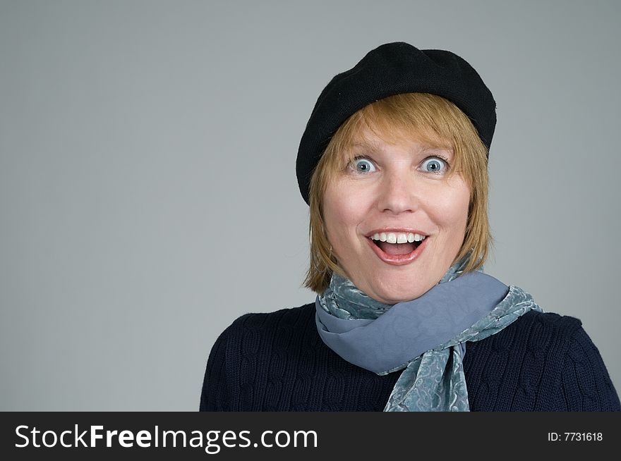 An attractive blonde mid-adult woman expression amazement or astonishment. Looking at camera. An attractive blonde mid-adult woman expression amazement or astonishment. Looking at camera.