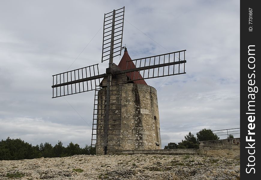 Daudet's windmill with cloudy sky in  Fontvielle.Provence France. Daudet's windmill with cloudy sky in  Fontvielle.Provence France