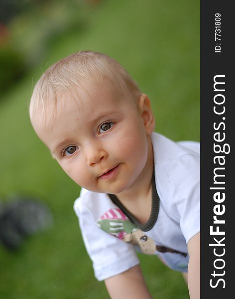 Beautiful little girl on  green grass. Beautiful little girl on  green grass