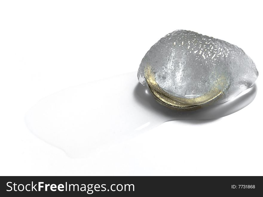 A coin inside a melting piece of ice. A coin inside a melting piece of ice