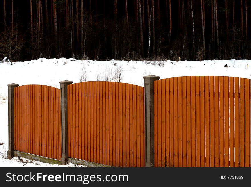 A wooden fence ,winter,snow