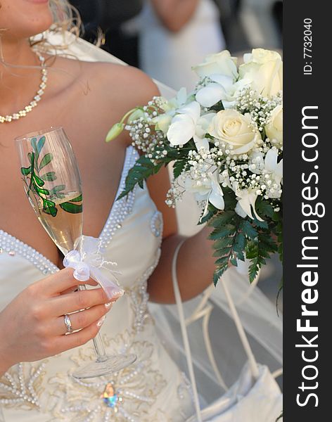 Bride wearing wedding dress and holding bouquet