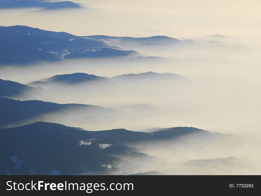 The Bavarian Forest was touched by some mist on a real cold winterday. Picture is taken out of a commercial plane. The Bavarian Forest was touched by some mist on a real cold winterday. Picture is taken out of a commercial plane.