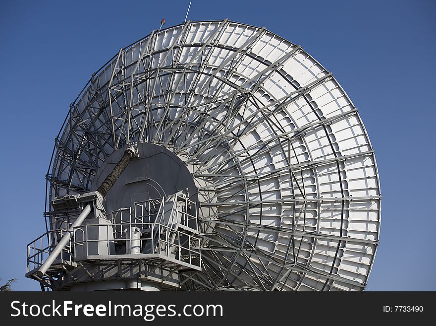 A large satellite dishes on blue sky