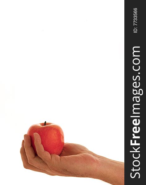 A hand holding a apple on white background