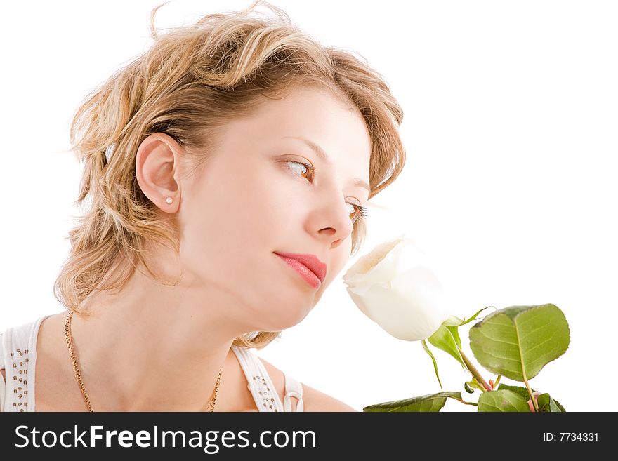 Portrait of attractive blond girl smelling white rose over white background. Portrait of attractive blond girl smelling white rose over white background