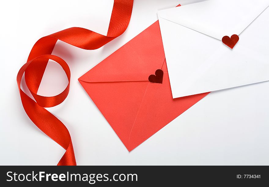 Red and white envelope and red bow. Red and white envelope and red bow