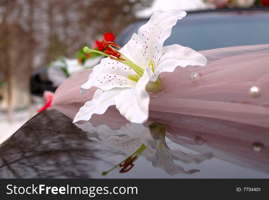 Wedding decoration (flowers) on black limousine car. Wedding decoration (flowers) on black limousine car.