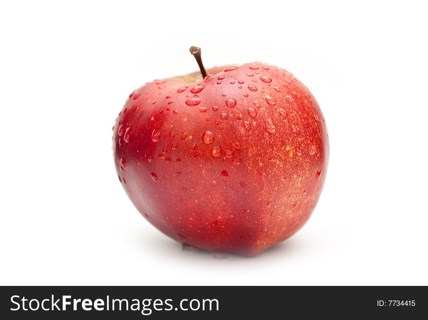 Apple with drops on a white background. Apple with drops on a white background