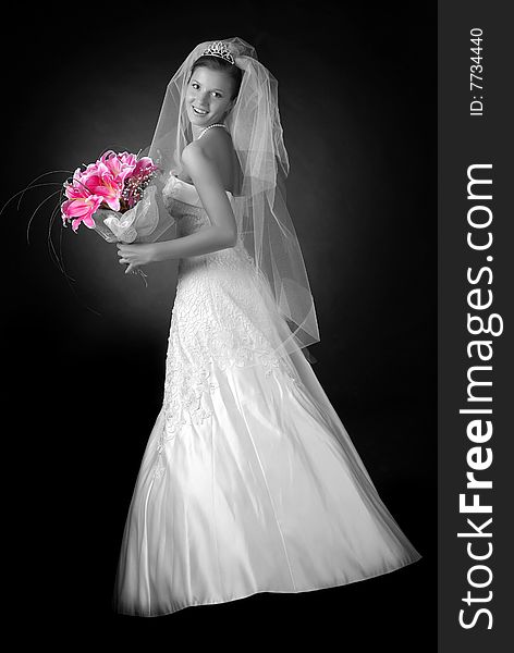 Young bride with bouquet of lilys on a black background