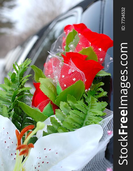 Wedding decoration on black limousine car.