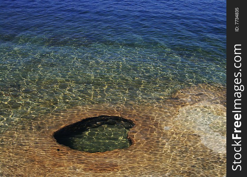 A heart shape pit in the geyser, West Thumb of Yellowstone Lake, Yellowstone. A heart shape pit in the geyser, West Thumb of Yellowstone Lake, Yellowstone.
