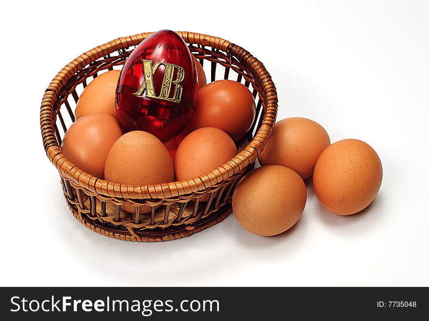 Easter egg in basket on white