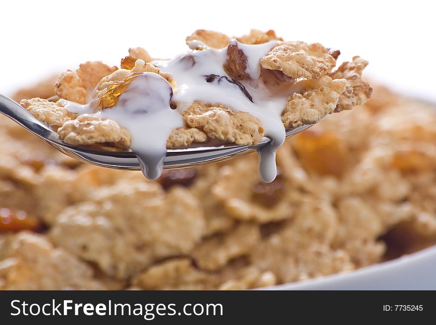 Bowl of cereal with raisins and milk