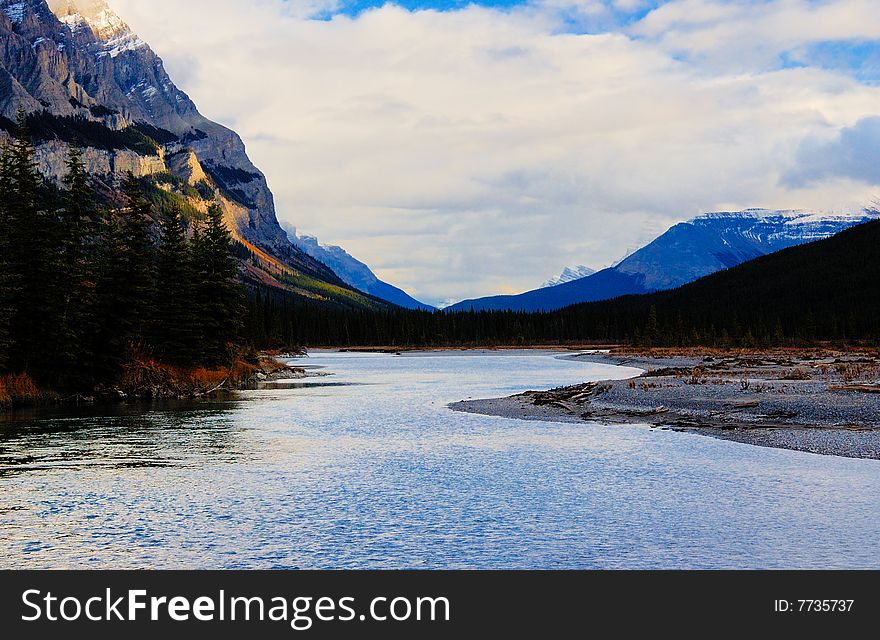 Glacier lake in the mountain in the early fall